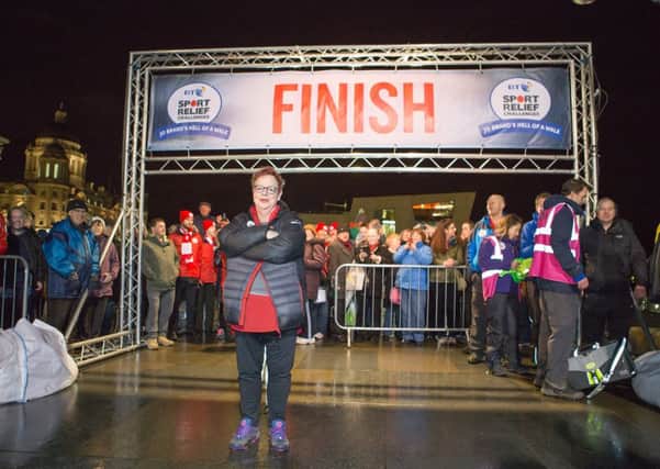 Comic Relief handout photo dated 28/1/2016 of Jo Brand arriving outside the Liver Building in Liverpool to finish her 150 mile walk from Hull to Liverpool for Sport Relief. PRESS ASSOCIATION Photo. Issue date: Friday January 29, 2016. See PA story CHARITY Brand. Photo credit should read: Ken Topham/Comic Relief/PA Wire

NOTE TO EDITORS: This handout photo may only be used in for editorial reporting purposes for the contemporaneous illustration of events, things or the people in the image or facts mentioned in the caption. Reuse of the picture may require further permission from the copyright holder.