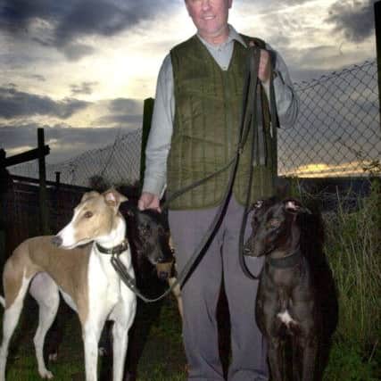 Dog trainer Harry Crapper takes some of his dogs in  2001