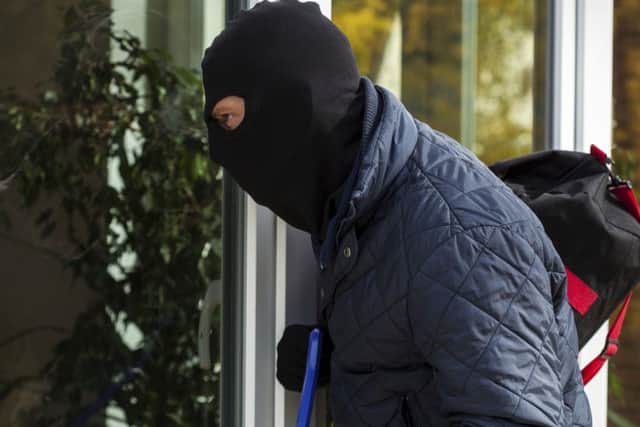 A Generic Photo of burglar attempting to gain entry to a house. See PA Feature TOPICAL Burglary. Picture credit should read: PA Photo/thinkstockphotos. WARNING: This picture must only be used to accompany PA Feature TOPICAL Burglary.