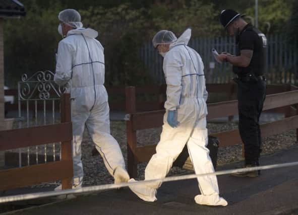 Police officers prepare to search a property on Beech Close Brierley in Barnsley where 2 bodies were discovered earlier today
Picture Dean Atkins