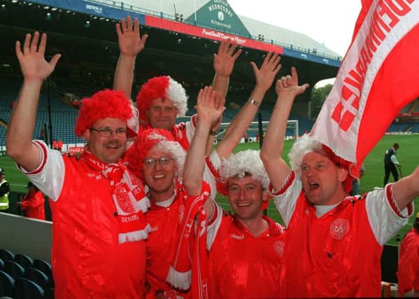 Danish fans waveing good-bye to Sheffield and Euro 96 after their countrys last game at Hillsborough in which they failed to qualify for the Quarter Finals.