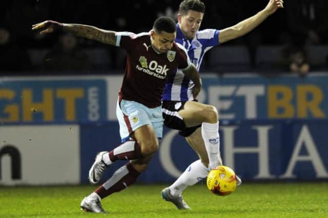 Sam Hutchinson tangles with Burnley goalscorer Andre Gray