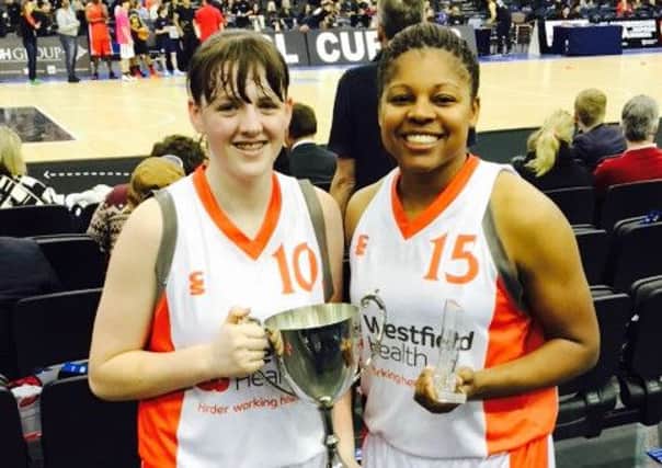 Fifteen-year-old Shauna Harrison with  Hatters star Steph Gandy and  the WBBL Trophy.