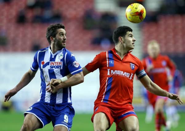 Wigan Athletic's Will Grigg (left)