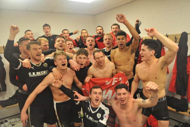 Barnsley players celebrate in the changing room after their penalty shoot-out success.