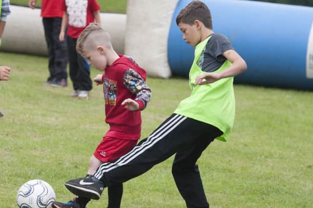 Activity Sheffield event in Norfolk Park during the school holidaysFootball fun as the new season gets closer  in the street kick arenaPicture Dean Atkins