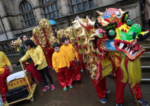The Chinese community do their Dragon parade as part of the new year celebrations out side the Town Hall