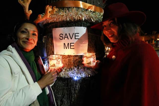 Sheffield tree campaigners' held a Christmas celebration with carols and mulled wine under Delilah, Tree 1, on Rustlings Road. Pictured are Deepa Shetty and Louise Wilcockson.