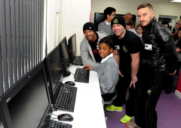 World champion boxer Kell Brook, Ryan Rhodes and Sam O'Maison with pupil Fatima Wright at the Hatfield Academy to open the new media centre. Picture: Andrew Roe