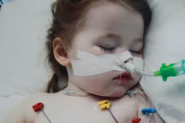 Clare Skill and daughter Sophie Skill, whose life was saved at Sheffield Children's Hospital last year after she swallowed a battery. Family now organising a charity event for to raise money for the hospital.  Sophie pictured in hospital last July.