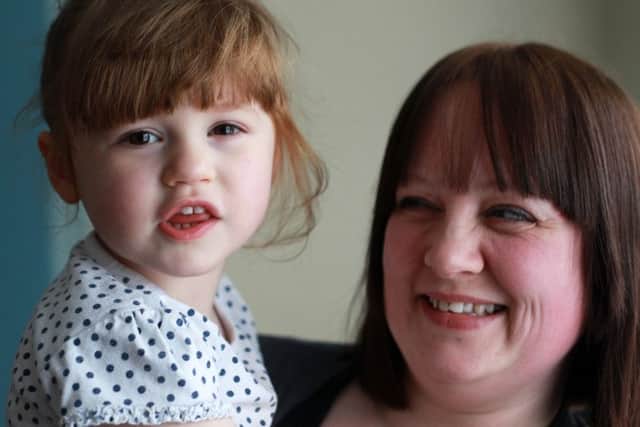 Clare Skill and daughter Sophie Skill, whose life was saved at Sheffield Children's Hospital last year after she swallowed a battery. Family now organising a charity event for to raise money for the hospital.  Photo: Chris Etchells.