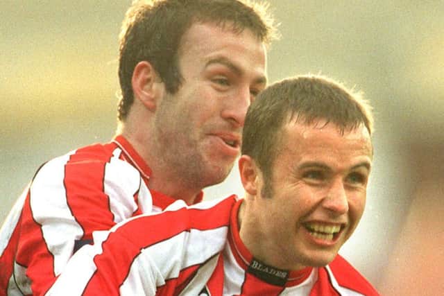 Paul Devlin celebrates his goal with team-mate Shaun Derry