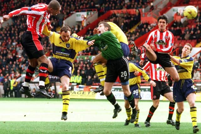 Marcus Bent heads home the first of his three