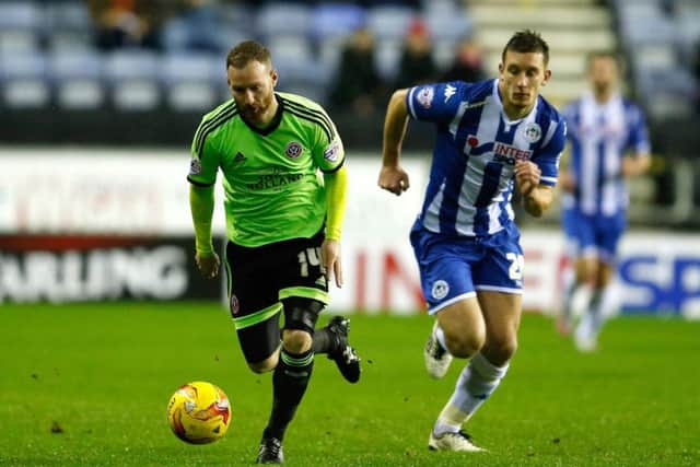 Matt Done races away during the Blades' last clash with Wigan where they came back from three goals down to draw 3-3
