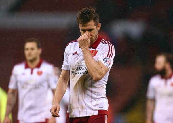 Blades'  Dean Hammond is dejected at full time Pic Philip Oldham/SportImage