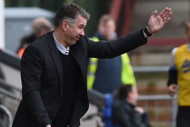 Darren Ferguson shouts instructions to his players.  Picture: Howard Roe