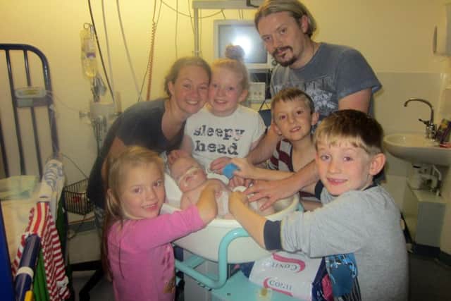 This pic shows baby Roman Morley the night before he died, with his parents and siblings. Left to right Scarlett Morley, mum Amanda Steele, Darcy Saynor, dad Steven Morley, Sam Morley and Theo Saynor.