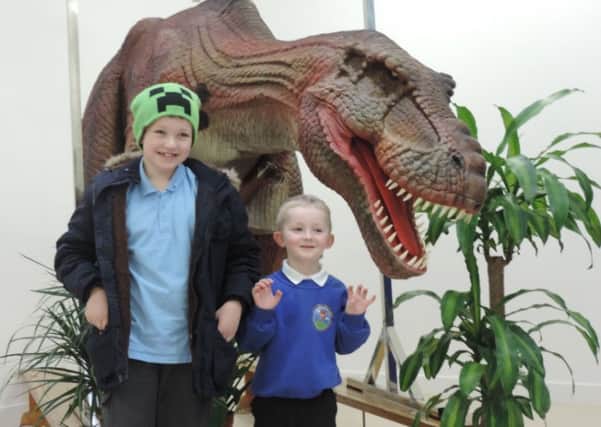 Fox Hill Primary pupils Oliver and Thomas with Sophie the dinosaur