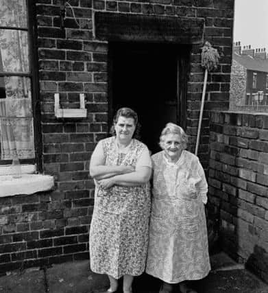 Mother and daughter, Sheffield backyard 1969 33-10a. Image taken by Nick Hedges for homeless charity Shelter.