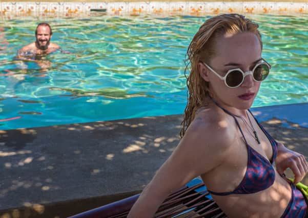 A Bigger Splash. Pictured: Dakota Johnson and Ralph Fiennes. See PA Feature FILM Reviews.: PA Photo/Icon.