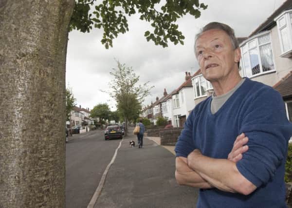 Dave Dillner next to trees under threat in Greenhill they feel should be saved