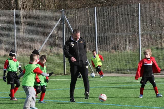 Rovers boss Darren Ferguson took time out this week to join youngsters at a half term coaching camp.