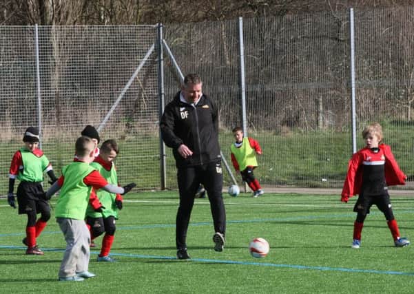 Rovers boss Darren Ferguson took time out this week to join youngsters at a half term coaching camp.