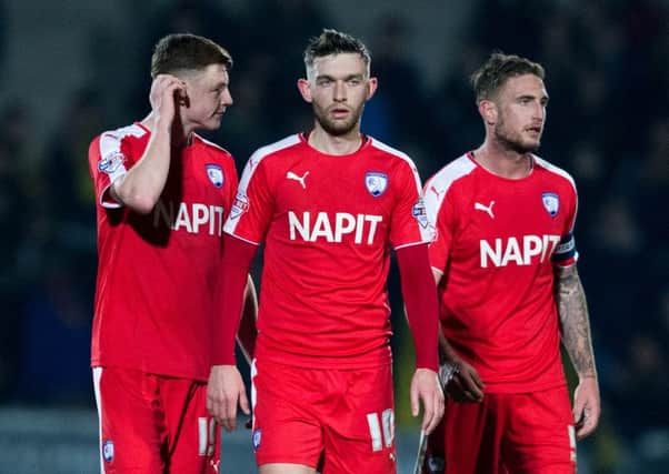 Dion Donohue, Jay O'Shea and Gary Liddel look dejected at full time in their defeat at Burton Albion