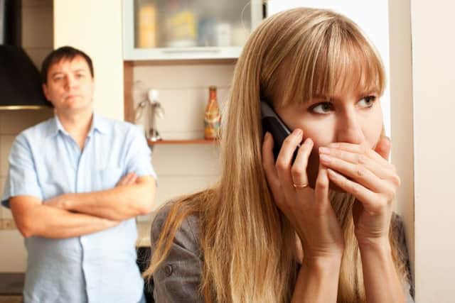 Wife confer privately on the phone