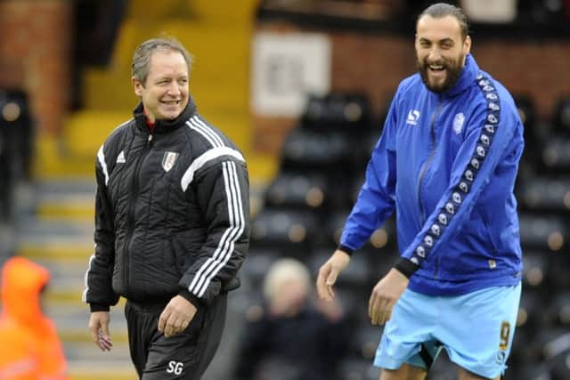 Owls striker Atdhe Nuhiu has a laugh with old boss Stuart Gray now working at Fulham