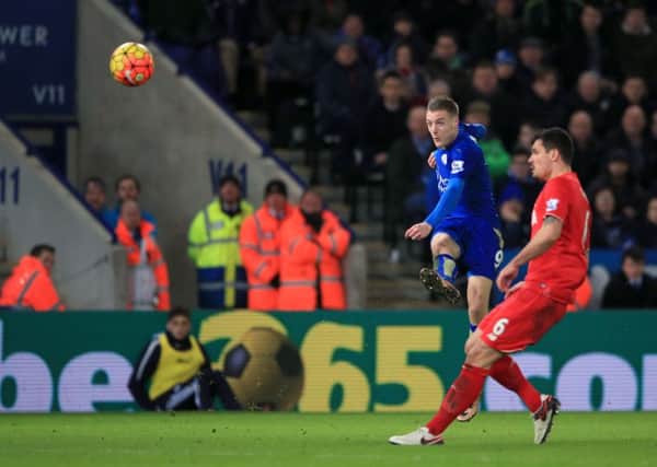 Leicester City's Jamie Vardy (left) scores his sides first goal against Liverpool