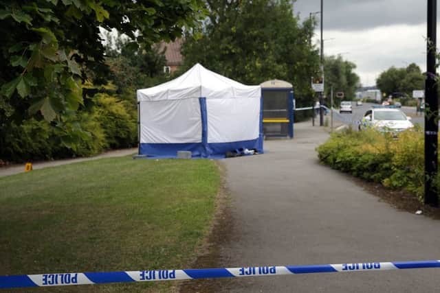 A forensic tent on Fitzwilliam Road in Rotherham following the murder of Mushin Ahmed last summer
