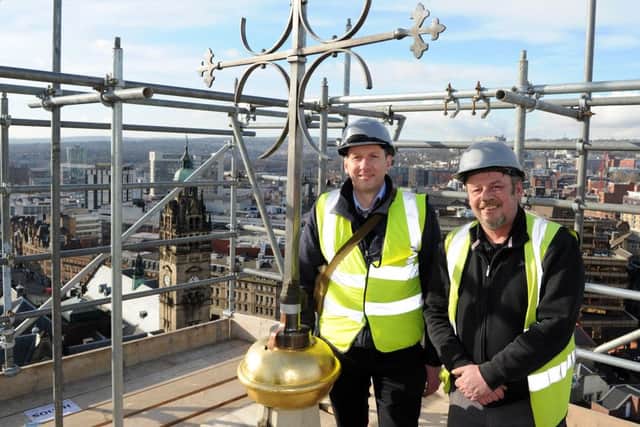 Bill Hall and Chris Hewitt, of Lloyd and Smith at the top of the Cathedral Church of St Marie next to the weathervane has been re-installed on the spire. Picture: Andrew Roe