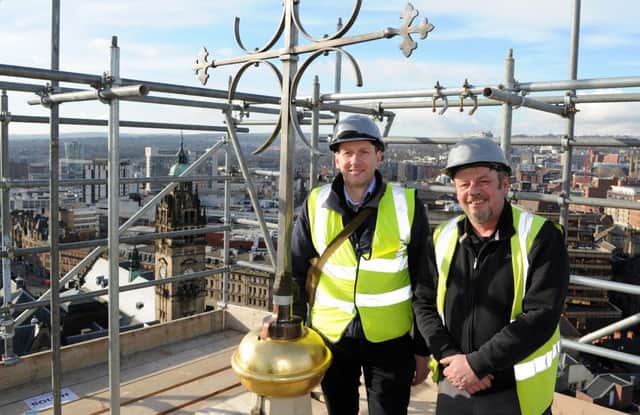 Bill Hall and Chris Hewitt, of Lloyd and Smith at the top of the Cathedral Church of St Marie next to the weathervane has been re-installed on the spire. Picture: Andrew Roe