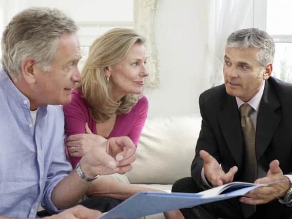 Retirees speaking with their financial advisor