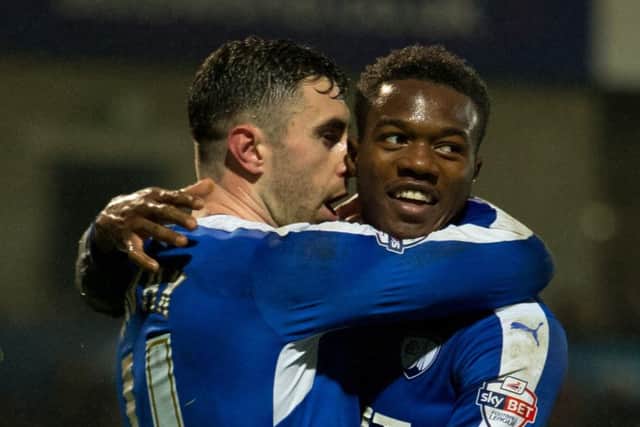 Gboly Aryibi celebrates with teammate Lee Novak during the 7-1 win over Shrewsbury Town