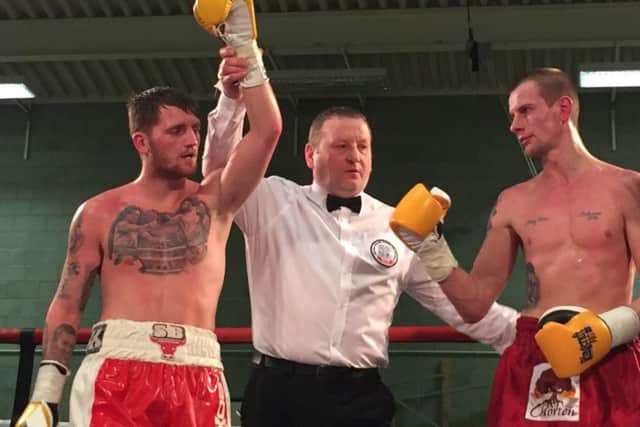 Robbie Barrett has his hand raised after victory over Sylwester Walczak