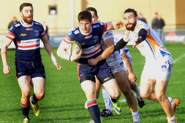 David Clark  of Doncaster Knights finds a gap in the Yorkshire Carnegie  defence at Castle Park