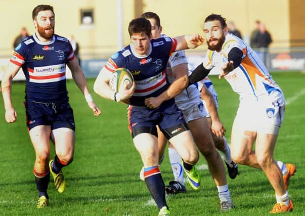 David Clark  of Doncaster Knights finds a gap in the Yorkshire Carnegie  defence at Castle Park