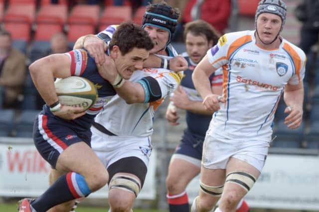 Knights' Paul Jarvis of Doncaster Knights tries to break the Yorkshire Carnegie defence. He later had to go off injured and the club will be checking on him today.