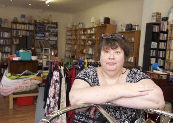 Liz Mason, shop manager at St Vincent's charity shop on Abbeydale Road in Sheffield where thieves distracted staff and stole Â£200. 
Picture by Dean Atkins