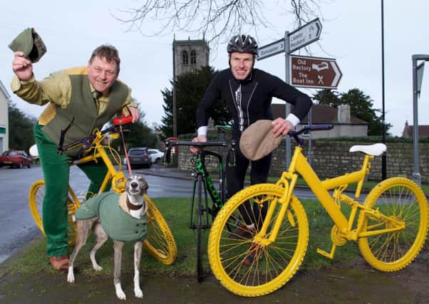 Doncaster Olympic and Commonwealth road cyclist John Tanner (right) with "Tyke" Paul Hall, proprietor of Sprotbrough Country Club and whippet Tigger with the yellow bikes. Photo: Shaun Flannery.