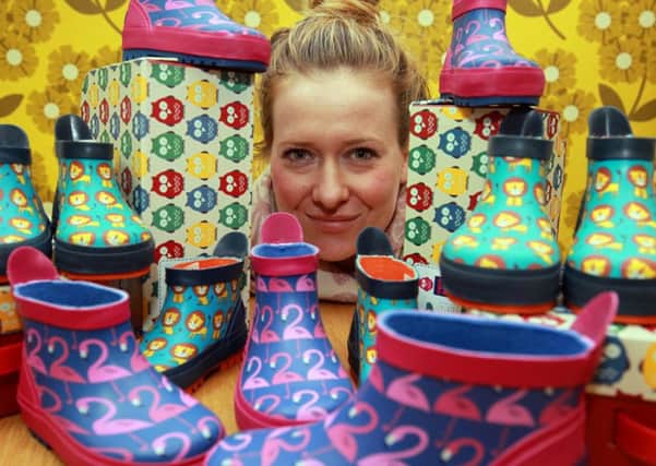 Sheffield based children's footwear and clothing brand, Poco Nido, has donated over 300 pairs of wellies to Syrian refugees to help them stay warm and dry during the colder months. Pictured is Joanna Vickers with some of the wellies.