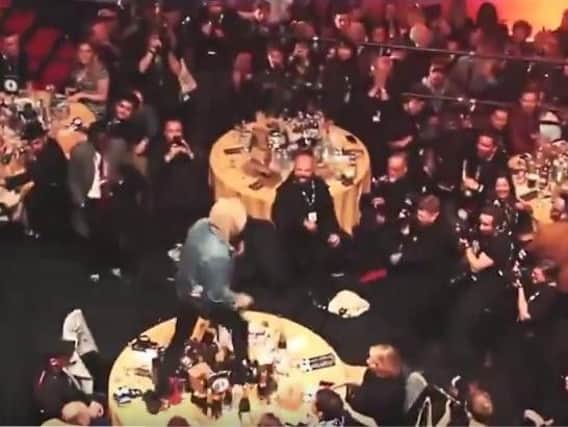 Oli Sykes, frontman of Sheffield band Bring Me The Horizon, stood on Coldplay's table at last night's NME Awards