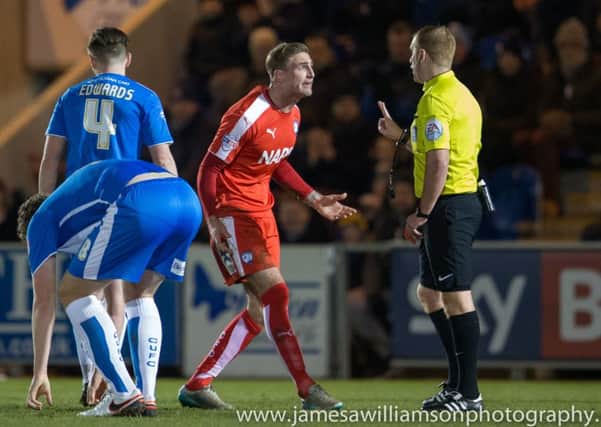 Colchester United vs Chesterfield - Gary Liddle protests to match referee L Swabey - Pic By James Williamson