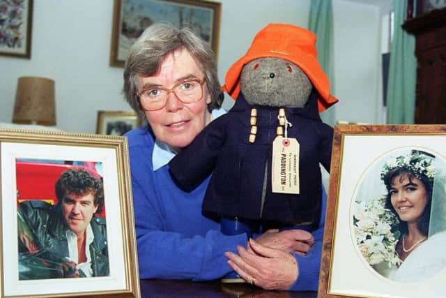 Shirley with pictures of her children, Jeremy and Joanna, who she made the first bears for.