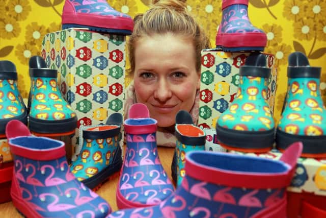 Sheffield based children's footwear and clothing brand, Poco Nido, has donated over 300 pairs of wellies to Syrian refugees to help them stay warm and dry during the colder months. Pictured is Joanna Vickers with some of the wellies.