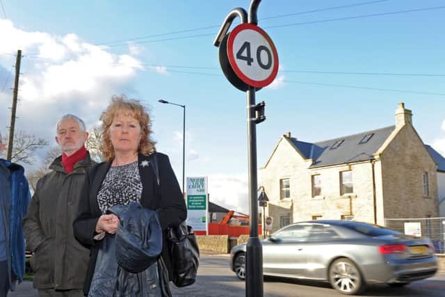 (l-r) Coun Geoff Smith, local resident Chris Batchelor, of Cairns Road and Coun Anne Murphy are petitioning for a 30mph speed limit on Manchester Road. Picture: Andrew Roe