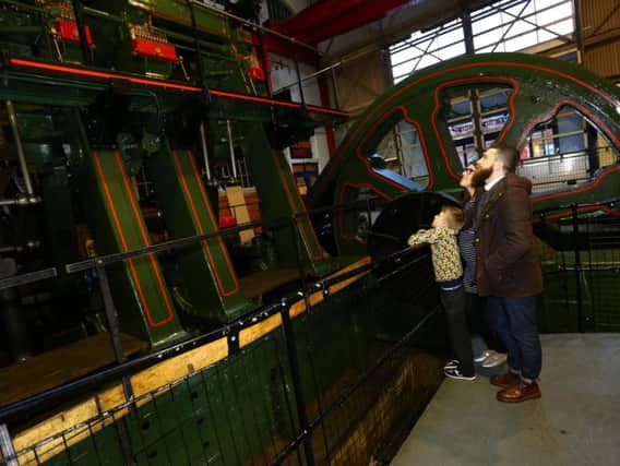 Visitors admiring the mighty River Don engine at Kelham Island Museum, Sheffield
