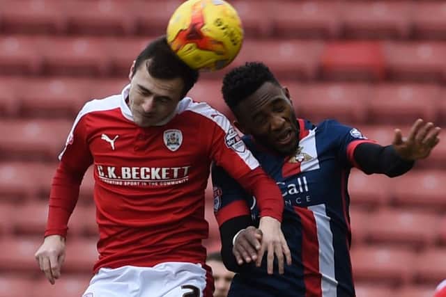 Cedric Evina goes up for a header during Doncaster's 1-0 defeat at Barnsley.